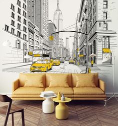 a living room with yellow couches and a wall mural depicting taxi cabs in new york city