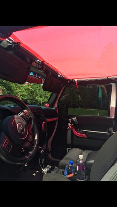 the interior of a car with its sun shade open