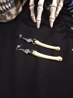 Here is a Lovely Pair of Real Coyote Bone earrings! They Were Made with Skull Charms. These Earrings are 4 Inches Long. All Items Ship Within 1-3 Days via USPS First Class Service. Shipping on These Earrings is 4.50 ( USA Only ) All Bone Jewelry Orders Over 35 USD $ Ship for FREE. International Shipping Will Be 16.00, Australia 18.00 And All Additional Items Add 1.00 to the Shipping Cost. International Shipping May Take 2 - 4 Weeks To Deliver. Please Note : We Cannot Be Responsible for Any Packa Unique Bone-colored Nickel-free Earrings, Handmade Adjustable Bone Colored Earrings, Bone Color Dangle Earrings With Ear Wire, Nickel-free Bone-colored Dangle Earrings, Nickel Free Bone Color Dangle Earrings, Bone Colored Earrings With Ear Wire For Gift, Nickel-free Bone Dangle Earrings, Wiccan Earrings, Witch Earrings