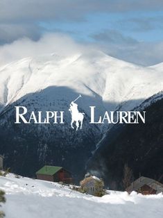 the words ralph lauren are displayed in front of snow covered mountains and houses on a cloudy day