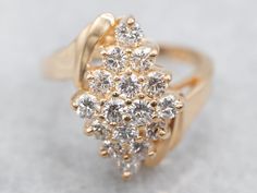 a gold ring with white diamonds on it