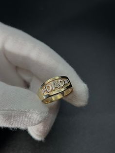 This is our Dad ring, the perfect gift for the Father figure in your life! - Made with solid 10KT gold and two cubic zirconia stones - Stamped "10KT" for authenticity - Made to order in any finger size, please allow 1-2 weeks for production Wear with love and care <3 ------------------------------------ SHIPPING POLICY - Items in stock ship typically within 1-3 business days.  - Certain items ordered in specific sizes/lengths (such as most of our rings) are made to order and require 5-10 busines Engraved Yellow Gold Couple Rings For Promise, Engraved Gold Couple Rings For Anniversary, Gold Engraved Couple Rings For Anniversary, Engraved Yellow Gold Couple Promise Rings, Promise Couple Rings In Yellow Gold Stamped 14k, Promise Couple Rings In Yellow Gold 14k, Personalized Cubic Zirconia Birthstone Promise Ring, Personalized Rings For Promise, Engraved Round Diamond Ring For Anniversary