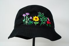 Item: mushroom embroidered bucket hat Material: 100% cotton Size: one size fits most Embroidery: hand made with acrylic thread Free first class shipping, upgradable priority mail service. 30 days return policy, feel confident at your purchase! Grey Bucket Hat, Wild Flower Garden, Lakers Hat, Embroidered Bucket Hat, Cotton Bucket Hat, Leather Hip Bag, Black Bucket Hat, Embroidery Hand, Cotton Hat