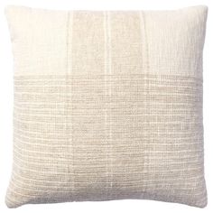 a white pillow with an uneven design on the front and back of it, against a white background