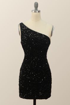 Be daring and dazzling in this sexy one-shoulder black sequin bodycon mini dress. It features a black sequin material that will hug your curves and a one-shoulder design that shows off your silhouette. The mini length will give you a flirty look and with a zip-up back, you'll look and feel confident. Dark Colored Hoco Dresses, Middle School Dance Dresses Black, Black Snowball Dresses, Masquerade Dresses Short, Winter Formal Dresses Short Black, Hoco Dresses One Shoulder, Black Sparkly Dress Hoco, Homecoming Dresses One Shoulder, Sparkly Black Hoco Dress