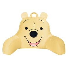 a yellow winnie the pooh pillow with ears