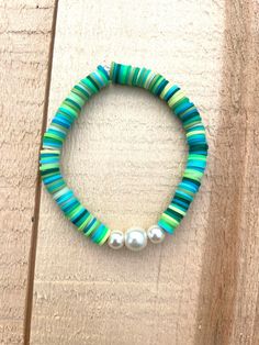 Green, blue, pearl clay beads Blue Pearl Bracelet With Colorful Beads For Beach, Blue Beaded Pearl Bracelet For Beach, Blue Beaded Pearl Bracelet For The Beach, Turquoise Beaded Pearl Bracelets, Blue Bohemian Pearl Bracelet With Colorful Beads, Blue Pearl Beaded Bracelets For Beach, Bohemian Blue Pearl Bracelet With Colorful Beads, Turquoise Pearl Beaded Round Beads Bracelets, Turquoise Pearl Beaded Bracelets