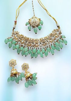 Silver jewelry gold plated with mint green beads. Includes adjustable necklace, earrings, & tika (headpiece). Green Bridal Necklace With Matching Earrings For Celebration, Bridal Green Necklace With Matching Earrings For Celebration, Festive Green Kundan Necklace With Matching Earrings, Green Beaded Chandbali Jewelry, Green Kundan Necklace With Matching Earrings For Festivals, Green Beaded Kundan Jewelry Sets, Green Necklace Set, Mint Green Necklace, Green Beads