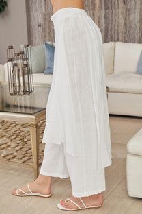 Milio Milano, style 10976, Linen Layered Skirted Pants – Southern Exposure Style Versatile White Full Length Pants, Versatile White Full-length Pants, Versatile Full Length White Pants, Versatile Full-length White Pants, Versatile White Bottoms For Spring, Elegant White Bottoms For Daywear, Elegant Cotton Beach Bottoms, Elegant White Wide Leg Pants With Elastic Waistband, White Full-length Wide Leg Pants For Day Out