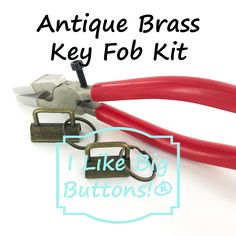 an antique brass key fob kit is shown with red handles and two pairs of scissors