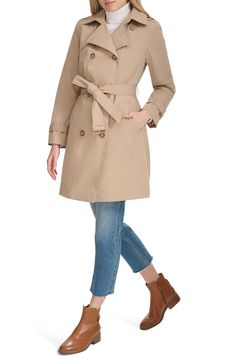 The ultimate all-season coat, this water-resistant trench has all the elements you want—a removable hood, an optional belt and a classic double-breasted silhouette. 37" length (size Medium) Double-breasted button closure Removable hood Belted cuffs Removable belt Front slant pockets Water resistant Lined, with polyester fill 100% polyester Machine wash, tumble dry Imported Women's Trench Coat, Hooded Trench Coat, Classic Trench Coat, Trench Coat Black, Quilted Coat, Black Sand, Trench Coats Women, Cole Haan, Double Breasted