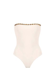 The Nancy in Latte by Seashell is a high cut One-Piece swimsuit. Dive into luxury with this strapless one-piece swimsuit adorned with opulent gold seashell hardware. Designed for the fashion-forward beachgoer, this swimsuit effortlessly combines elegance and allure.
 Size: S, M, XXL, L, XL Strapless One Piece, Eyewear Kids, Summer 2025, Black Swimwear, White Jewelry, One Piece Swim, Swimwear Outfit, High Cut, Eyewear Sunglasses