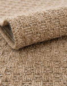 a close up view of the textured fabric on top of a bed sheet or rug