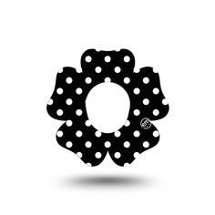 a black and white polka dot flower with the letter o in it's center