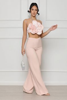 This freshly bloomed pants set features a big flower design on the top with a rhinestone jeweled halter neck. Model wearing size small Fits true to size for most 95% Polyester 5% Spandex Inseam: 33.5 Inches Luxury Pink Maxi Length Set, Luxury Pink Maxi-length Set, Luxury Designer Pink Palazzo Set, Luxury Pink Palazzo Set For Transitional Season, Luxury Pink Party Wear Sets, Luxury Elegant Pink Sets, Luxury Flared Party Sets, Luxury Trendy Spring Flares, Luxury Elegant Spring Flares