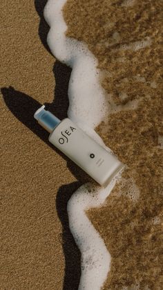 an oja tube laying on the sand at the beach