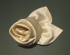 "Rosette pin, 100% silk satin. This handmade pin is ideal to wear on a lapel or as a trimming for a special dress or hat.                The pin back itself is gold plated brass and has a silk covered backing for a fine finished appearance. This pin is crafted of a softly shimmering pure silk satin.  Size: about 3.75\" diameter. ~ You can find payment, shipping and return information by clicking the link below- http://www.etsy.com/shop/LoVeElegance/policy?ref=shopinfo_policies_leftnav ~ To view Wooden Rocking Horse, Lavender Heart, Special Dress, Dupioni Silk, Handmade Pins, Special Dresses, Fine Craft, Gold Silk, Silk Roses