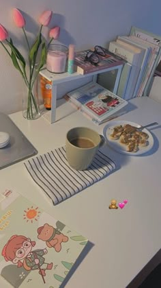 there is a bowl of cereal on the table next to some books and flowers with pink tulips in the background