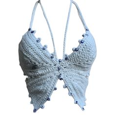 a white bra with blue beads hanging from it