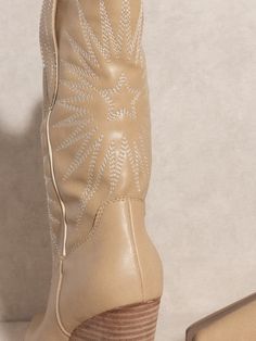 Introducing the Oasis Society Emersyn Starburst Embroidery Boots. With their confident yet effortless Bohemian style, these cowboy boots will have you standing out in any crowd. The eye-catching supernova stitching adds a touch of whimsy to your wardrobe, making these boots an essential addition to any outfit. Color: Black, Almond, & White Made of: Man-made material Brand: Oasis Society Includes: x1 Pair of Boots Sizes: 6, 6.5, 7, 7.5, 8, 8.5, 9 or 10Shaft Height: 9"Heel Height: 3.5"The front pl Western Beige Embroidered Boots, Western Embroidered Beige Boots, Embroidered Beige Western Boots, Starburst Embroidery, Embroidery Boots, The Oasis, Tattoo Inspo, Bohemian Style, Cowboy Boots