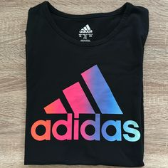 Black With Multi-Color Accents Short-Sleeve Adidas T-Shirt, Size Xl (16). Washed Once, Never Worn, Like New! Smoke Free And Pet Free Home Adidas Multicolor Graphic Print T-shirt, Sporty Multicolor Tops With Logo Print, Sporty Multicolor Adidas Tops, Adidas Sporty Multicolor Tops, Adidas Multicolor Short Sleeve Tops, Adidas Multicolor Crew Neck T-shirt, Black Sports Tops With Heat Transfer Vinyl, Adidas Multicolor Graphic Print Tops, Adidas Multicolor Casual Tops