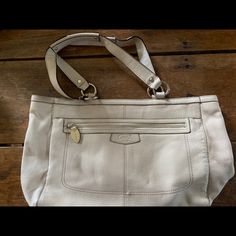 Beautiful Vintage White Handbag With Pink Lining! Top Zip Closure And Pockets On Both Front, Back And Inside. Very Roomy Bag. Coach Cream Shoulder Bag For Travel, Coach Cream Tote Shoulder Bag, Coach Tote Shoulder Bag With Top Carry Handle, Coach Beige Bag For Everyday Use, Coach Shoulder Bag For Everyday, Everyday Beige Coach Bag, Coach Cream Shoulder Bag With Top Carry Handle, Coach Beige Satchel For Everyday Use, Coach Beige Shoulder Bag For Everyday