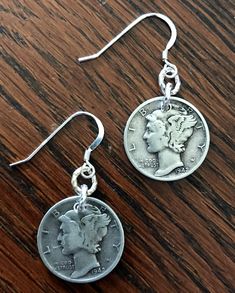 "We are proud to offer up for your consideration these lovely handmade up-cycled Sterling Silver Earrings! You can also choose from a variety of custom hand stamped gift boxes! See below for your options! PLEASE NOTE! THE PICTURES SHOWN ARE FOR REFERENCE ONLY! I UTILIZED DIMES FROM THE YEAR 1942, BUT YOU CAN SELECT ANY YEAR AVAILABLE FROM THE DROP DOWN MENU! THE NATURAL PATINA CAN VARY GREATLY BUT CONDITION WILL BE VERY SIMILAR. If you would like to see the exact coins I will be using for your o Vintage Antique Silver Dangle Jewelry, Antique Silver Vintage Dangle Jewelry, Vintage Antique Silver Dangle Earrings, Vintage Dangle Earrings For Anniversary, Adjustable Retro Nickel-free Jewelry, Handmade Antique Silver Vintage Earrings, Handmade Vintage Antique Silver Earrings, Vintage Silver Earrings For Gift, Vintage Jewelry With Ear Wire For Anniversary