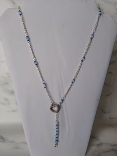 Silver plated chain set with faceted Aquamarine beads and seed beads with a heart decoration and Aquamarine swirl design drop. Total length of the chain is 21" but it is adjustable to how short you want it by sliding the chain in the heart. FREE UK POSTAGE I only purchase my gemstones from trusted UK suppliers Aquamarine is a stone of courage.  Its calming energies reduce stress and quiet the mind.  Aquamarine has an affinity with sensitive people.  It can invoke tolerance of others and overcome How To Regulate Hormones, Sensitive People, Aquamarine Beads, Les Chakras, Heart Decorations, Swirl Design, Adjustable Necklace, Heart Design, Crystal Necklace