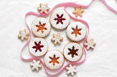 several cookies are arranged in the shape of a christmas tree on a white tablecloth