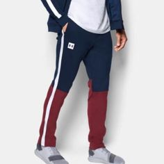 Under Armour Track Pant New With Tags Mens Medium Navy/Maroon Colorway Zippered Pockets Casual Under Armour Pants, Under Armour Casual Streetwear Pants, Sporty Cotton Pants By Under Armour, Under Armour Bottoms With Elastic Waistband, Under Armour Streetwear Bottoms With Pockets, Under Armour Cotton Sports Pants, Under Armour Bottoms With Pockets For Streetwear, Casual Cotton Pants By Under Armour, Under Armour Cotton Bottoms With Pockets