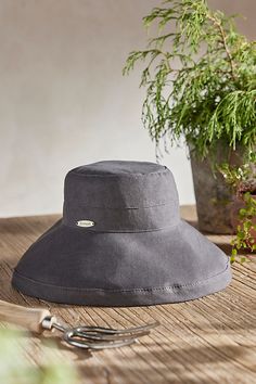 Handmade from lightweight and breathable cotton and branded with terrain exclusive details, this colorful crusher hat is perfect for a day at the beach or in the garden. Packable construction pairs with UPF 50 sun protection and an inner drawstring to assure a comfortable fit. | Cotton Crusher Hat in Grey at Terrain Lightweight Summer Bucket Hat For Vacation, Linen Sun Hat With Curved Brim For Vacation, Linen Summer Hat For Outdoor, Summer Linen Hat For Outdoor, Adjustable Linen Bucket Hat For Summer, Summer Linen Sun Hat With Curved Brim, Linen Bucket Hat For Beach, Adjustable Casual Linen Hats, Lightweight Upf 50+ Bucket Sun Hat