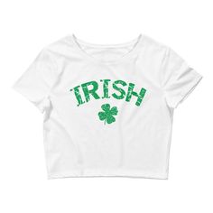 This cute Irish Shamrock Crop Top is perfect for celebrating St Patrick's Day. A lucky four leaf clover design which is perfect for anyone who loves a good Irish Party. Please check the Size Guide as this Tee is very form fitting. GENERAL DESCRIPTION: This T-Shirt is cropped short and sits below the bust and above the navel. It is tight and form hugging, therefore not for the shy, especially if you have a larger bust! STYLE GUIDE *Tight & Form Fitting *Cropped Short *Side Seams MATERIAL 52% St. Patrick's Day Cotton Crew Neck Tops, Cotton Crew Neck Top For St. Patrick's Day, Green Letter Print Top For St. Patrick's Day, Cotton Top With Letter Print For St. Patrick's Day, Irish Party, Clover Design, Irish Shamrock, Day Drinking, Saint Patricks