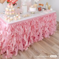 a table topped with lots of cupcakes and cakes