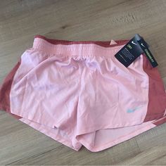 Nike 10k Shorts In Light Pink Color Lined Brief Women’s Size Medium New With Tags Never Worn Nike Shorts With Built-in Liner For Spring, Nike Athletic Shorts For Spring, Nike Shorts For Spring, Nike Athletic Shorts For Summer, Nike Summer Activewear Shorts, Nike Summer Athletic Shorts, Nike Short Leg Bottoms For Summer, Nike Activewear With Built-in Shorts For Summer, Nike Summer Workout Shorts