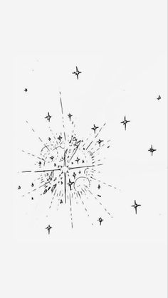 a black and white photo of fireworks in the sky with stars coming out of it