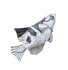 an origami fish made out of folded paper