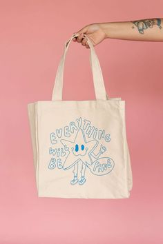 "Introducing this cutie star now available in a tote bag so you can take her everywhere you go! * 100% Canvas Tote Bag/ Blue Design * Tote Bag has an inside pocket * Printed in Brownsville, Texas by the JZD Team * Pocket inside Measurements Tote bag: 14\" x 14\" Depth: 5.5\" Handles: 11\"" Casual Star-shaped Shoulder Bag For Everyday, Casual Star-shaped Shoulder Bag, Tote Bag Ideas Design, Cute Merch, Handpainted Tote, Brownsville Texas, Star Now, Cloth Painting, Handpainted Tote Bags