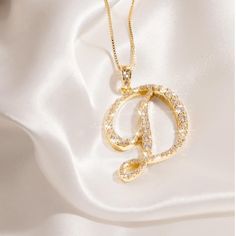 Gold Rhinestone Initial Necklaces With A Lobster Clasp Closure. Cz (Cubic Zirconia) Pave Pendent Necklace With A Fully Embellished Letter. All Rhinestones Are Intact. Necklace Length Measurement 18.5”-21”. More Letters Available!!! Doesn’t Come In A Box. ***Also Available In Silver*** Approx Length: 22 Made In Korea D Necklace Initial, D Initial Necklace, Letter D Necklace, D Necklace, D Initial, Initial Necklaces, Gold Letter Necklace, Length Measurement, Gold Letter