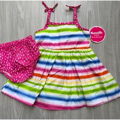 Prepare Them To Make A Pretty Impression When Temperatures Climb By Dressing Them In This Striped Sleeveless Dress That Flaunts Contrast Dotted Fabric Along Bow-Capped Straps. Matching Bloomers Keep Their Diaper Sweetly Under Wraps. Includes White Multicolor Stripe Sleeveless Dress And Pink Polka Dot Bloomers (Two Pieces Total) 100% Cotton Machine Wash; Tumble Dry Imported Features: Sundress, Bloomers Size: Babys 12m Condition: New With Tags Summer Sleeveless Playtime Dresses, Summer Sleeveless Dresses For Playtime, White Summer Sundress For Playwear, White Sundress For Summer Playwear, Cute Sleeveless Sundress For Playtime, Multicolor Sleeveless Dress For Summer Playtime, Playful Sleeveless Sundress For Play, Playful Sleeveless Dress For Summer Playdate, Playful Sleeveless Summer Dress For Playdate