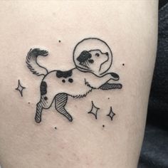 a dog is flying through the air with a moon on it's back leg