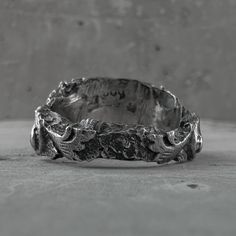 Ruins ring Sterling silverProcessing Type: volcanic oxidation+polishingTop:mmBack:mmWeight: (Depends on size)DESCRIPTION: Born from the artist's contemplation among ruins and giant trees, this unique ring embodies the monumental beauty of a bygone era. Every detail reflects the charming imperfection of the ancient sandstone buildings, giving a glimpse of the enduring charm of Cambodian heritage. All products are oxidized with volcanic sulfur that we collected while traveling in Indonesia, which Brutalist Oxidized Open Ring, Brutalist Open Ring With Oxidized Finish, Brutalist Oxidized Open Ring Jewelry, Brutalist Style Open Ring Jewelry, Brutalist Sterling Silver Rings With Oxidized Finish, Brutalist Hand Cast Open Ring, Brutalist Silver Engraved Rings, Silver Brutalist Hand-cast Rings, Brutalist Silver Hand Cast Rings