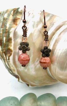 Eye catching dangle earrings with round pink Czech glass and antique bronze flower beads. Pretty and colorful handmade earrings for your unique style. Always makes a great gift! Etsy Earrings Dangle, Beaded Flowers, Czech Glass, Handmade Earrings, Antique Bronze, Unique Style, Jewelry Earrings Dangle, Dangle Drop Earrings, Dangle Earrings