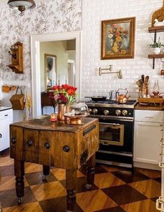 a kitchen with an old fashioned stove and checkerboard flooring on the walls