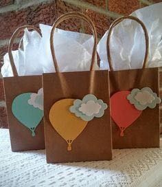 three brown bags with hot air balloons on them