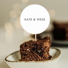 a piece of cake on a plate with a sign that says kate & messe