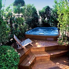 a hot tub sitting on top of a wooden deck