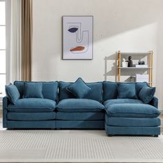 a living room with a blue sectional couch