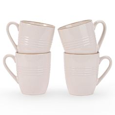 four white cups stacked on top of each other