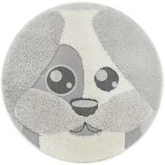 a round rug with a panda face on it