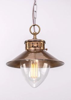 an old fashioned light hanging from the ceiling